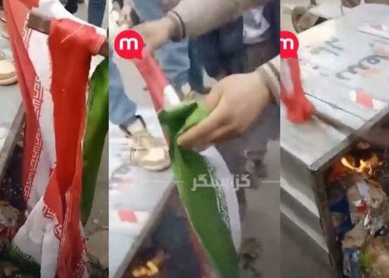 İranda etirazçılar bayrağı zibil qutusuna atıb yandırdı - Video